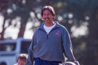 John Beam during football practice at Skyline high school in Oakland, California, on 5 October 2000. Photograph: Kendra Luck/AP | The Guardian
