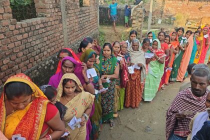 Voters queue outside a rural polling booth in Bihar during Phase-1 polling on 6 Nov 2025.