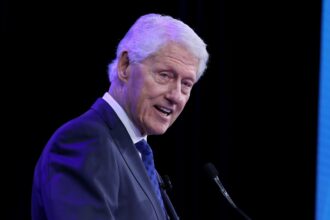 bill-clinton-smiling-and-laughing-in-photo-during-epstein’s-testimony