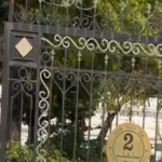 security-breach-at-an-assembly-complex-in-delhi:-a-masked-man-in-a-car-smashes-through-the-gate,-drops-a-bouquet-of-flowers,-and-drives-away