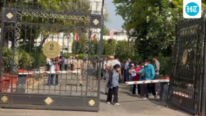 security-breach-at-an-assembly-complex-in-delhi:-a-masked-man-in-a-car-smashes-through-the-gate,-drops-a-bouquet-of-flowers,-and-drives-away