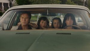 ‘the-end-of-oak-street’-by-anne-hathaway-reveals-a-closer-look-at-dinosaurs-and-people-being-‘eaten’