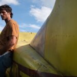 jacob-elordi-flies-in-the-first-trailer-for-ridley-scott’s-the-dog-stars