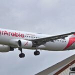 a-passenger-jumps-from-an-air-arabia-plane-after-landing-at-chennai-airport-while-riding-in-a-taxi