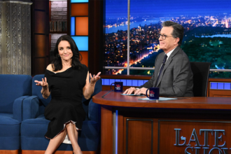 stephen-colbert-kisses-pedro-pascal-and-julia-louis-dreyfus-on-the-late-show-a-day-after-hugging-jimmy-fallon