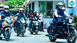 maharashtra-cm-fadnavis-rides-bike-to-vidhan-bhavan-after-pm-modi’s-appeal-to-conserve-fuel-|-he-watches