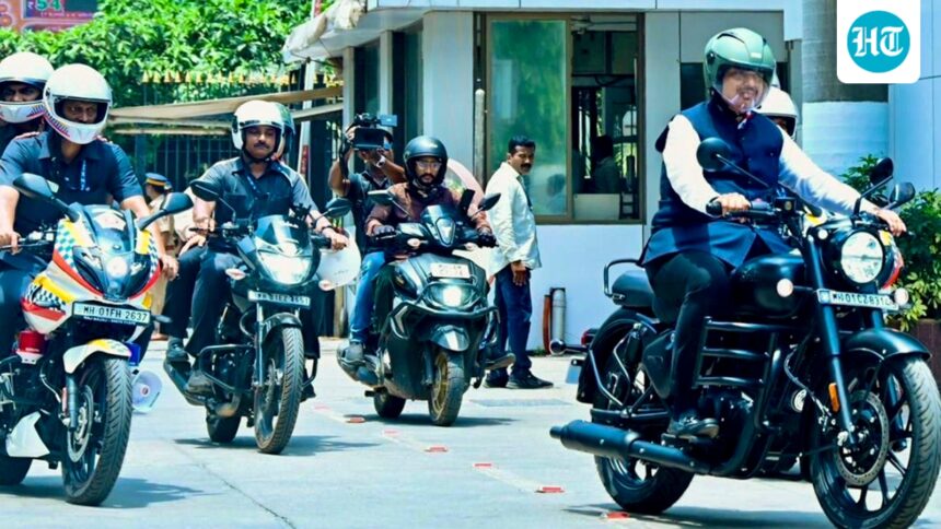 maharashtra-cm-fadnavis-rides-bike-to-vidhan-bhavan-after-pm-modi’s-appeal-to-conserve-fuel-|-he-watches