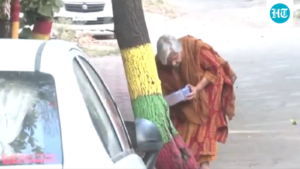 twisha-sharma’s-mother-in-law,-gribala-singh,-was-seen-feeding-a-stray-dog-​​after-her-anticipatory-bail-was-cancelled.