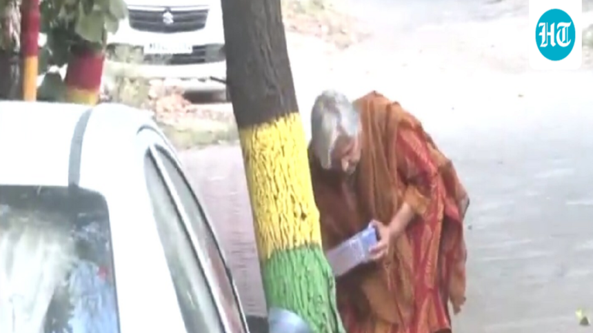 twisha-sharma’s-mother-in-law,-gribala-singh,-was-seen-feeding-a-stray-dog-​​after-her-anticipatory-bail-was-cancelled.