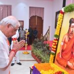 tvk-and-dmk-criticize-guv-as-he-praises-photo-of-thiruvalluvar-in-saffron-outfit