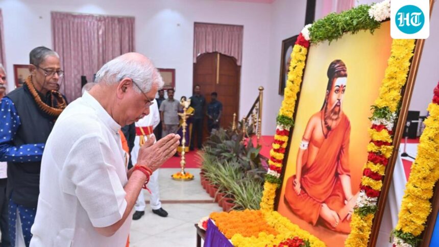 tvk-and-dmk-criticize-guv-as-he-praises-photo-of-thiruvalluvar-in-saffron-outfit