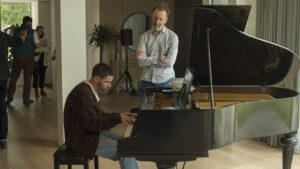 john-carney-praises-nick-jonas-for-not-strong-arming-himself-for-the-‘power-ballad’-soundtrack.