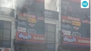 people-cling-to-ropes-as-fire-rips-through-lucknow-building,-killing-15:-video
