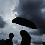 commuters-are-facing-delays-due-to-heavy-rains-disrupting-train-services-in-mumbai
