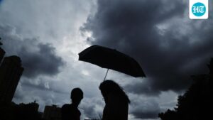 commuters-are-facing-delays-due-to-heavy-rains-disrupting-train-services-in-mumbai