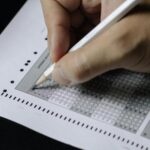 gujarat-hc-dismisses-false-charges-in-gpsc-exam-cheating-case,-allows-investigation-to-continue