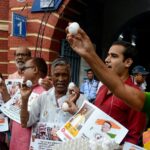 after-flying-off-as-weapons,-the-eggs-now-land-in-the-middle-of-the-line-for-midday-meals-in-bengal