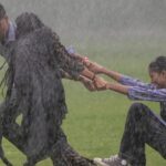waterlogged-roads-or-a-stream?-kids-swim-on-streets,-traffic-snarls-as-heavy-rain-pounds-delhi-ncr