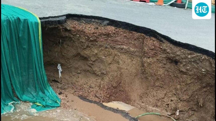 gurugram-sewer-line-breach-causes-road-cave-in-at-iffco-chowk;-traffic-diverted