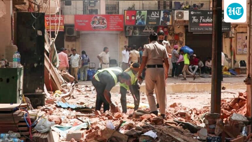 delhi-building-collapse-live:-demolition-of-structure-next-to-collapsed-pg-begins;-contractor-held-in-satya-niketan