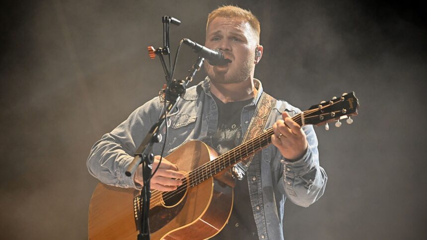 zach-bryan-wears-‘free-palestine’-shirt-during-concert-at-robert-kraft’s-gillette-stadium